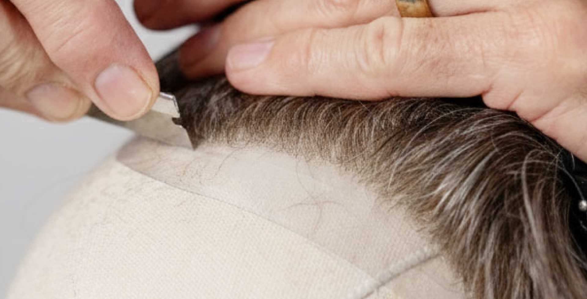 image of cutting a hair system for right length and style